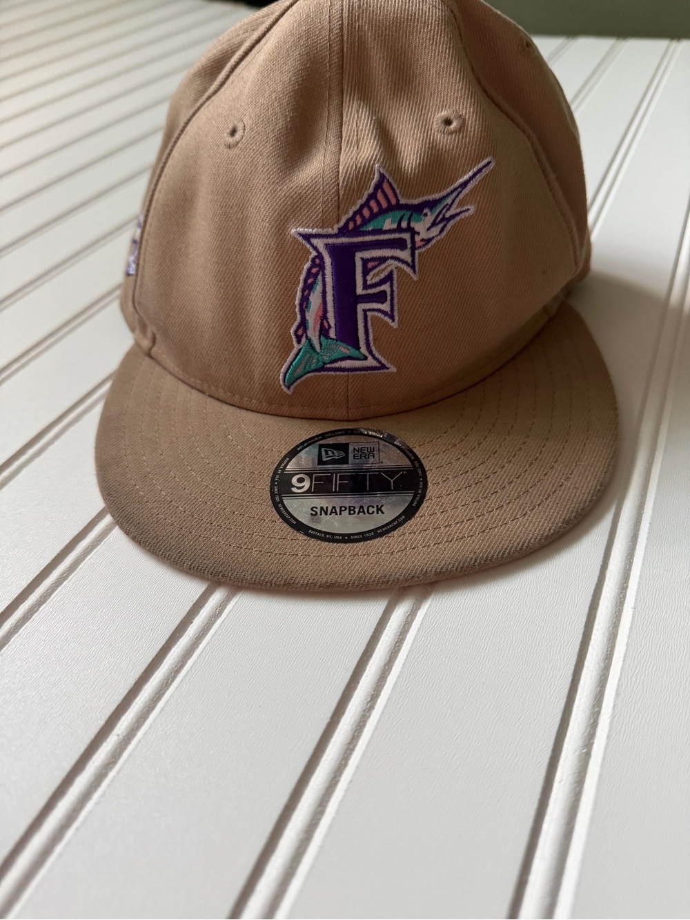 New Era Tan Snapback Hat with Purple & Teal Marlin F Logo
